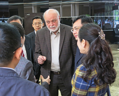 Richard Hart speaks with individuals from China